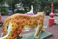 Singapore - May 29, 2016: Tiger or cheetah looking at the goddess of peace on a lotus flower