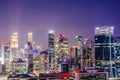 Aerial view of skyline business building and financial district from rooftop, Modern towers and skyscrapers illuminated at night Royalty Free Stock Photo