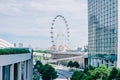 Cars traffic on Sheares ave with Singapore Flyer giant ferris wheel on background Royalty Free Stock Photo