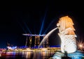 SINGAPORE - NOV 22, 2018: The Merlion fountain spouts water in front of the Marina Bay Sands hotel in Singapore. This fountain is