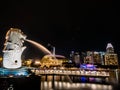 SINGAPORE - NOV 22, 2018: The Merlion fountain spouts water in front of the Marina Bay Sands hotel in Singapore. This fountain is