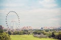 Singapore flyer`s cabin with cloudy sky background,Big ferris wheel in the modern city skyline and bay water on front, Singapore