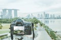 Travel photographer shooting landscape of singapore city during the sunset with professional DSLR camera