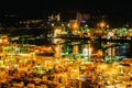 Aerial view of busiest cargo port with hundreds of ships loading export and import goods and thousands of containers in harbr