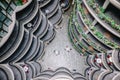 Interior of The Hive aka Dim Sum Baskets building, Tornado building, Heatherwick Studio with students seating at the chill area. Royalty Free Stock Photo