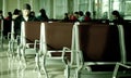 Business man waiting at departure gate for boarding airplane Royalty Free Stock Photo