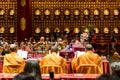 Buddhist monks in robes perform ceremony inside Buddha Tooth Relic Temple, Chinatown, Singapore Royalty Free Stock Photo