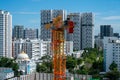 Construction crane against Singapore residential skyline