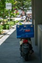 Delivery motorbike of Singapore Post post parked downtown Singapore