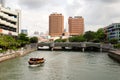 Singapore river view with a boat passing by Royalty Free Stock Photo