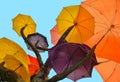 SINGAPORE - Sculpture of tree with colorful umbrellas against blue sky in public park on South Bridge Road near t