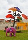 SINGAPORE Sculpture of tree with colorful umbrellas against blue sky in public park on South Bridge Road near t