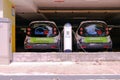 Singapore Sep2020 Back view of car sharing electric vehicles parked at charging station in multi-storey carpark. BlueSG is a