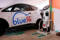 Singapore Sep2020 Car sharing electric vehicle parked at charging station in multi-storey carpark. BlueSG is a subsidiary of the