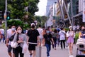 Singapore Sep2020 People wearing face masks crossing a road selective focus. Crowd picks up in Orchard Road during Phase 2 after