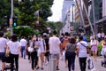 Singapore Sep2020 People wearing face masks crossing a road selective focus. Crowd picks up in Orchard Road during Phase 2 after