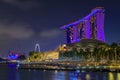 View of the illuminated famous luxury hotel, shopping center and casino Marina Bay Sands after sunset Singapore