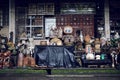 Shop front of vintage antique store that sells a treasure trove of old second hand furniture and homeware Royalty Free Stock Photo