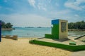 SINGAPORE, SINGAPORE - FEBRUARY 01, 2018: Informative sign over a stoned structure located over the sand in Palawan