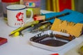 SINGAPORE, SINGAPORE - JANUARY 30, 2018: Close up of assorted tools with a brown painting inside of a plastic tray