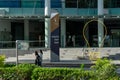 SINGAPORE, SINGAPORE - Sep 10, 2020: Two young women walk pass the Singapore Management University