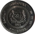 Singapore ten-cent coin features Emblem with date underneath and `Singapore` on four sides in English, Tamil, Chinese, and Malay. Royalty Free Stock Photo