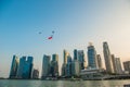 Singapore 50 years National Day rehearsal helicopter hanging Singapore flag flying over the city Royalty Free Stock Photo