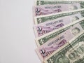 Singaporean banknotes of two dollars and American one dollar bills Royalty Free Stock Photo