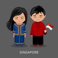 Singaporeans in national dress with a flag.