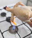 Singeing chicken on fire