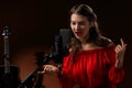 Singer in front of the microphone in the recording Studio