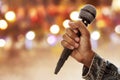 Singer hand holding wireless microphone