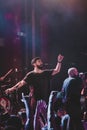 Singer Rayden singing at a touring concert in Barcelona with the audience