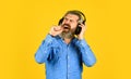 Singer on rehearsal. Hipster enjoy excellent sound song in earphones. Music beat. Noise cancelling function. Man bearded