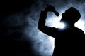 Singer singing silhouette on dark background Royalty Free Stock Photo