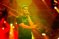 Singer Songwriter Drake live in concert on stage with backing band