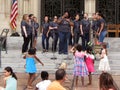 Singers and children at the Flower Mart