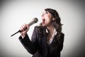 Singing beautiful young businesswoman