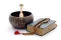 Singing bowl, book and wooden rosary. Royalty Free Stock Photo