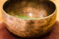 Singing Bowl on a Pillow angle view Royalty Free Stock Photo