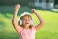 Singing and dancing children. Child with headphones listening to music outdoor. Royalty Free Stock Photo