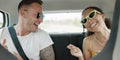 Singing, dancing and couple in car on road trip in countryside listening to music together. Happy, love and young man Royalty Free Stock Photo