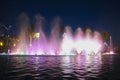 Singing fountain, illuminated by a colored light. Royalty Free Stock Photo