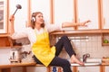 Singing housewife at home Royalty Free Stock Photo