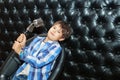 Singing little boy with a microphone on a rack Royalty Free Stock Photo