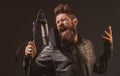 Singing man in a recording studio. Expressive bearded man with microphone. Expressive singer with microphone. Royalty Free Stock Photo