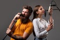 Singing man and young woman in a recording studio. Expressive couple with microphone. Happy friends with excited faces Royalty Free Stock Photo
