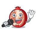 Singing mascot half of fresh pomegranate fruits