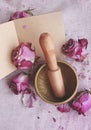 Singing Tibetan yoga bowl. Purple flower and little Book