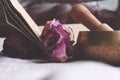 Singing Tibetan yoga bowl. Purple flower and little Book